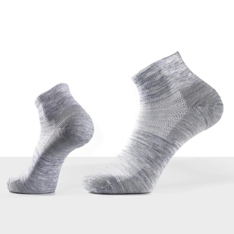 Folded merino polo and ankle socks bundle styled together, neutral tones, Merino 365