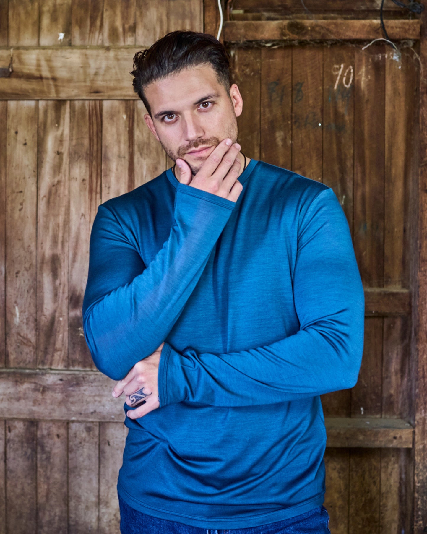 Close-up of Orion blue merino knit texture on the Merino 365 OG long sleeve — fine-gauge weave detail.