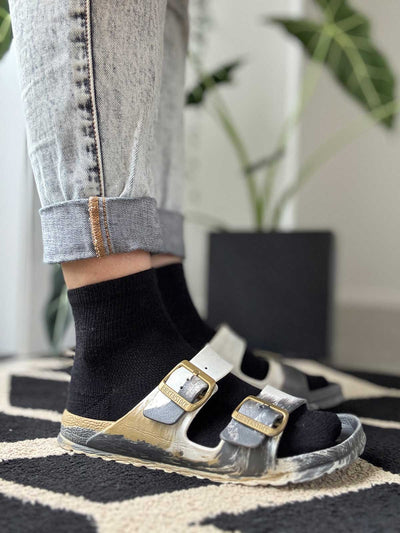 Black Merino 365 ankle sock styled on Birkenstock sandals, showing low-cut fit and fine-knit merino texture