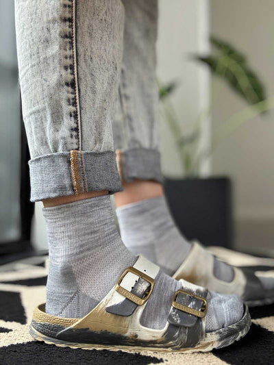 Grey merino ankle sock worn with Birkenstock sandals, showing low-profile fit and fine-knit texture