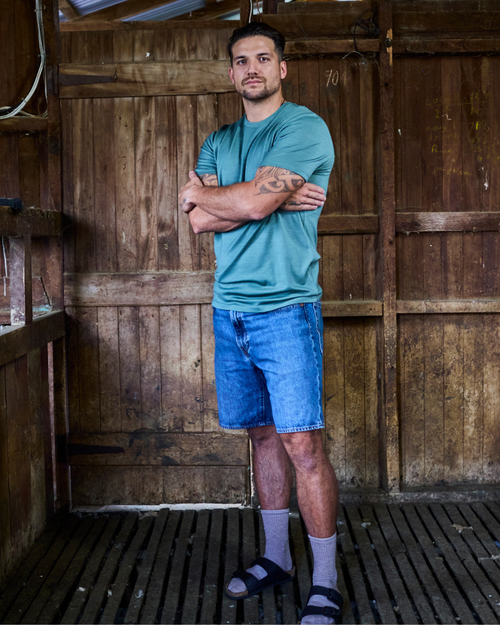 Fern green merino crew-neck tee — short sleeve, fine-knit finish, clean minimal silhouette by Merino 365