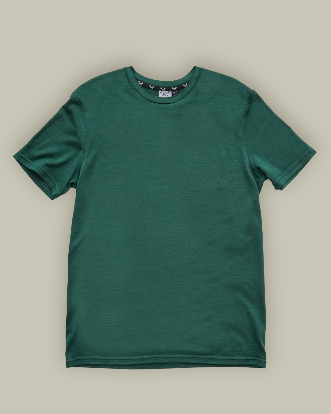Close-up of pine green merino knit texture — fine weave, crew neck collar detail, Merino 365