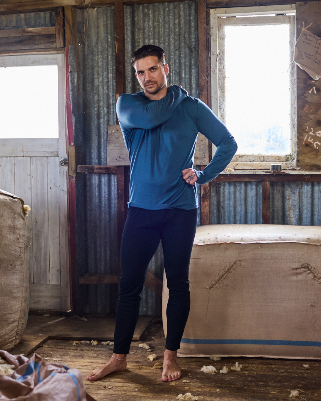 Back view of black Merino 365 base layer pants showing clean seam construction and relaxed fit in 100% merino wool.