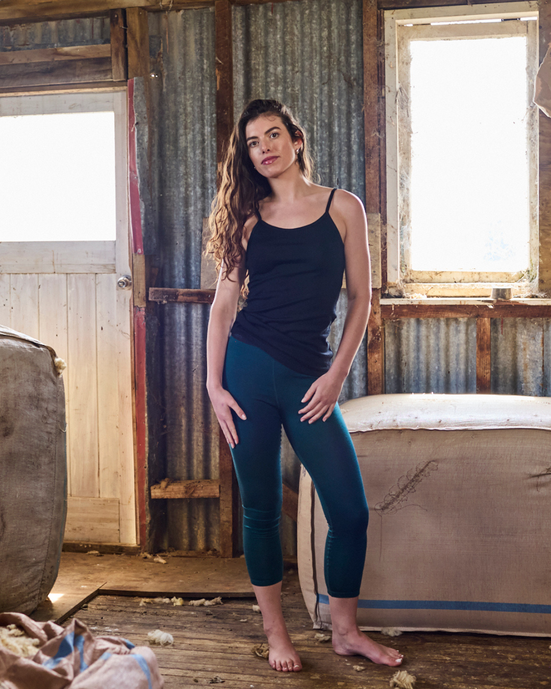 Pine green slim-fit merino wool base pant, tapered full-length leg, clean minimal finish — Merino 365.