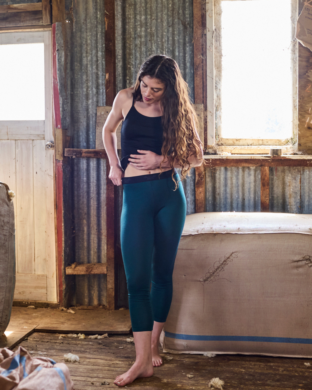 Pine green slim merino wool pant — rich earthy tone, tailored leg, Merino 365 women's base layer.