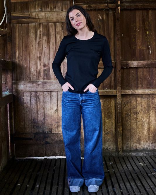 Black merino wool long sleeve top with crew neckline — Merino 365 women's fitted base layer, lightweight fine-gauge knit.
