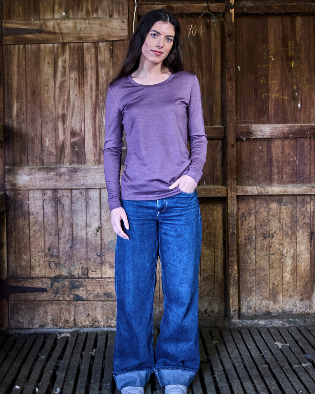 Back view of plum merino wool long sleeve top, showing clean seam finish and fitted silhouette