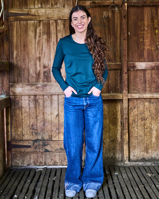 Pine green merino wool long sleeve top by Merino 365 — relaxed crew neck, clean minimal cut.
