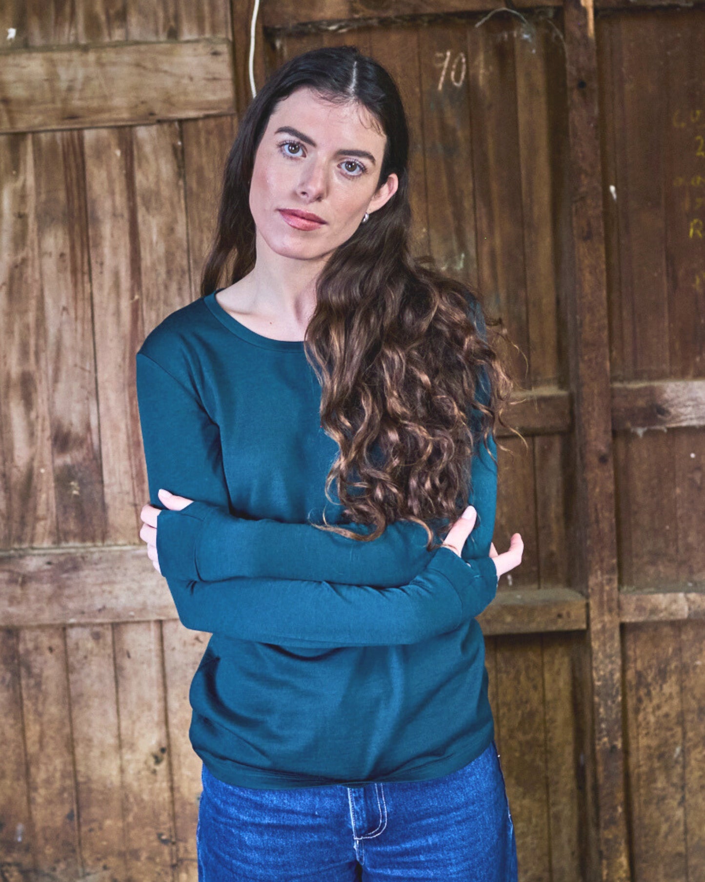 Back view of pine green merino long sleeve top — relaxed fit, clean neckline, Merino 365 craftsmanship.