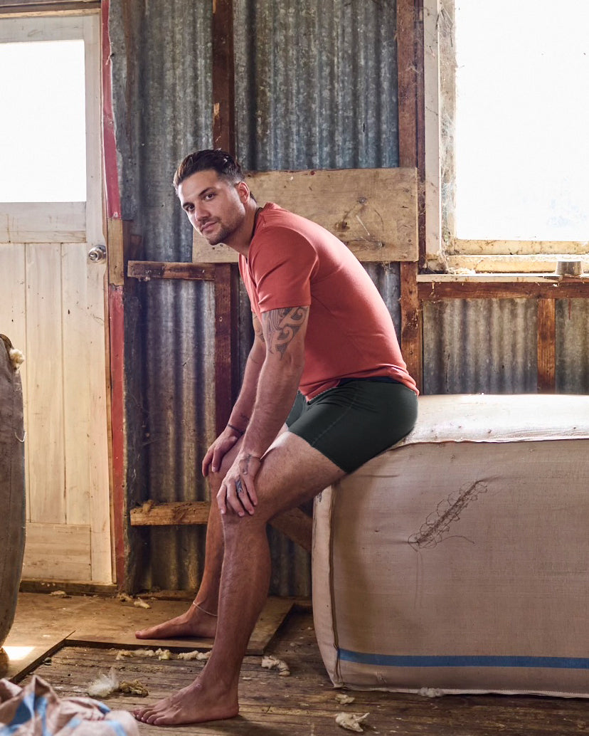 Black merino T-shirt and desert-tone boxer brief set by Merino 365, laid flat on clean background.